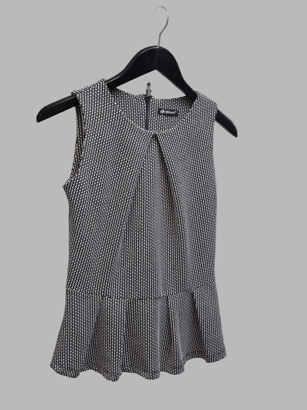 Blusa sin mangas peplum