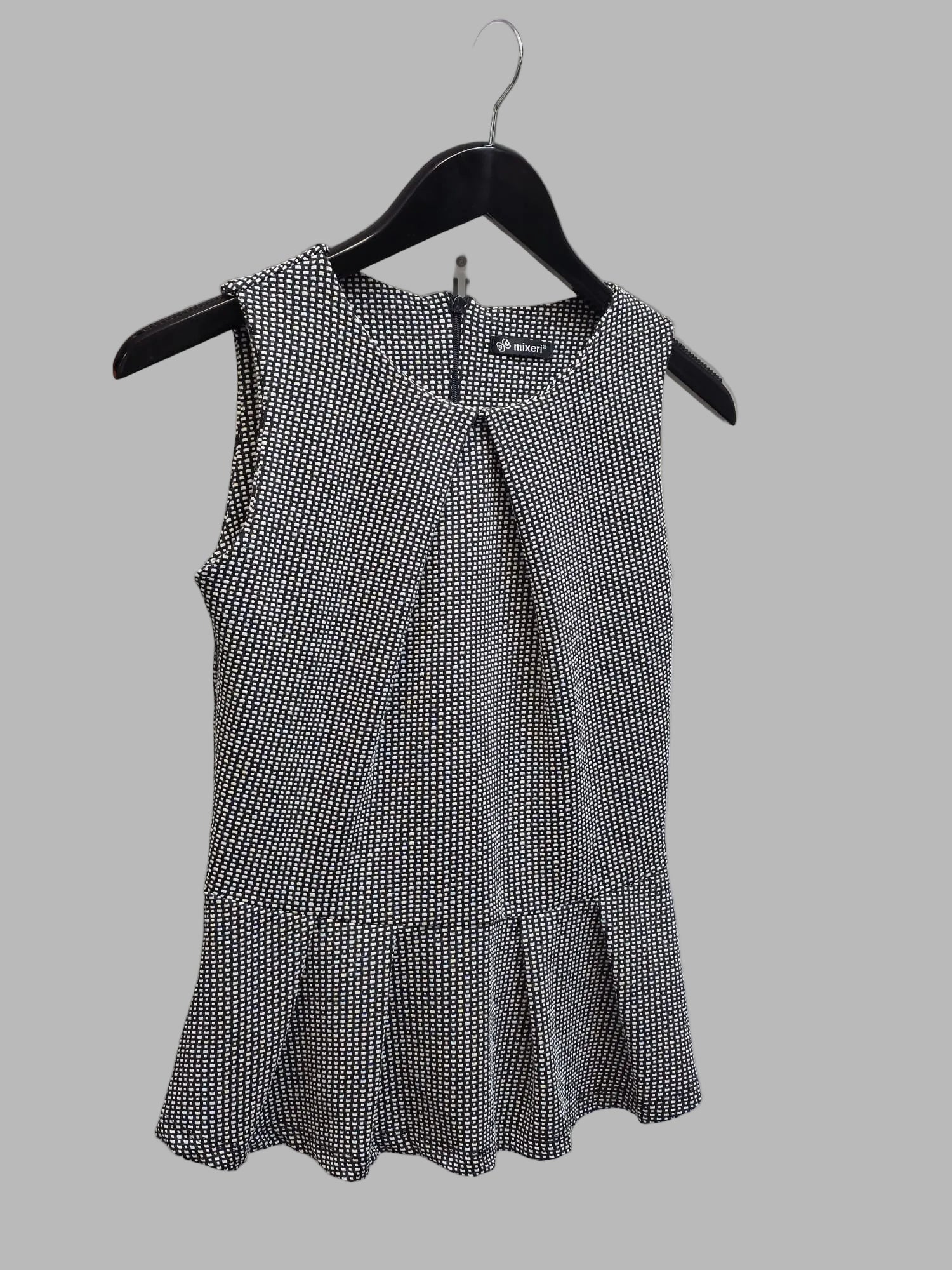 Blusa sin mangas peplum