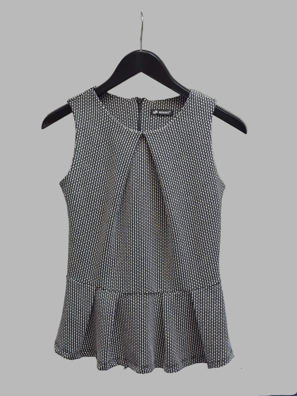 Blusa sin mangas peplum