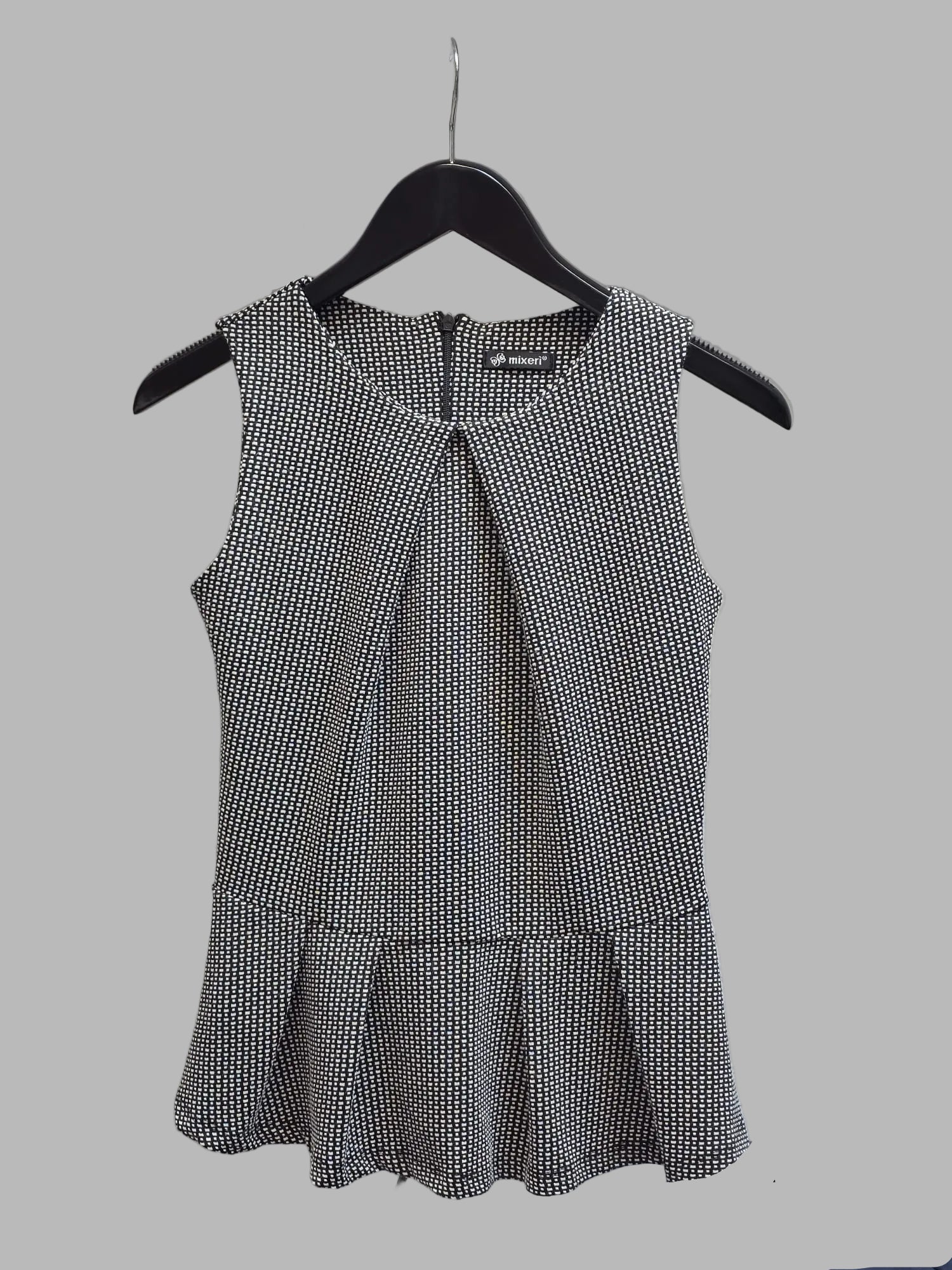Blusa sin mangas peplum